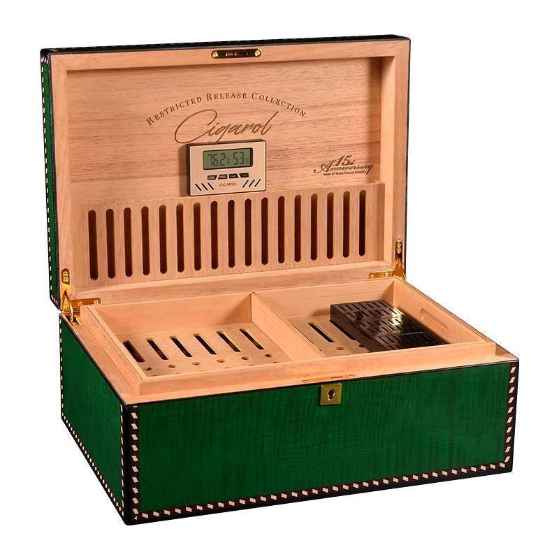 Elegant wooden cigar humidor box with green exterior, digital hygrometer, and interior cedar lining for optimal humidity control.